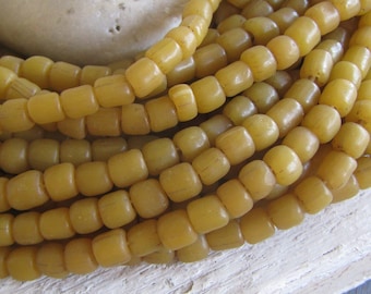 yellow ochre  glass seed bead,  barrel tube, small  spacer , indonesian 5 to 6.5mm dia, new indo-pacific (22 inches) 22ab14-18