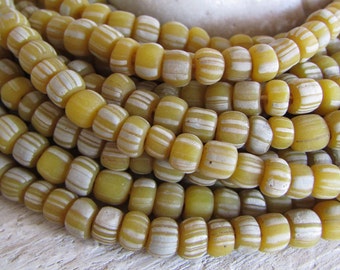 yellow Small glass seed bead, striped white , indonesia New Indo-pacific 5 to 6.5mm dia (22 inch strd) 21ab19-2