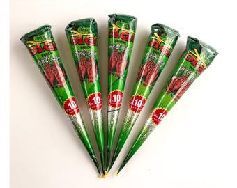 May include: Six green and red henna cones with the text "नेचुरल इंस्टेंट मेहंदी कोन" and "Rs. 10" printed on them.
