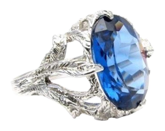 Handmade Sterling Silver Claw Cocktail Ring: Faceted Tanzanite Stone