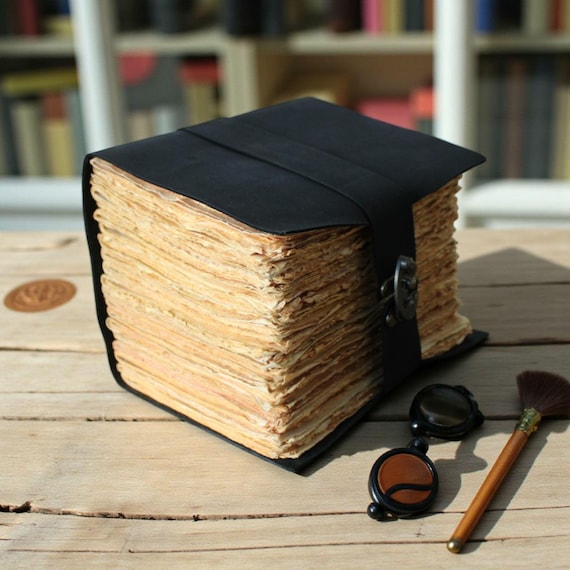 600 pages of thick leather-bound grimoire energy — the kind of journal that makes you want to write by candlelight.
