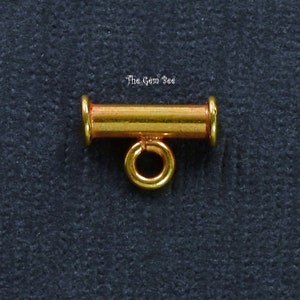 May include: Gold-toned metal toggle clasp with a round loop. The clasp is designed for jewelry making.