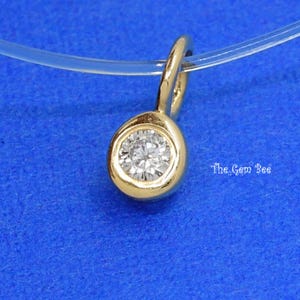 Minimalistyczna zawieszka z brylantami o szlifie brylantowym i o masie 0,05 ct, wykonana z litego żółtego i białego złota próby 14k, z dużym otworem 3 mm (1)