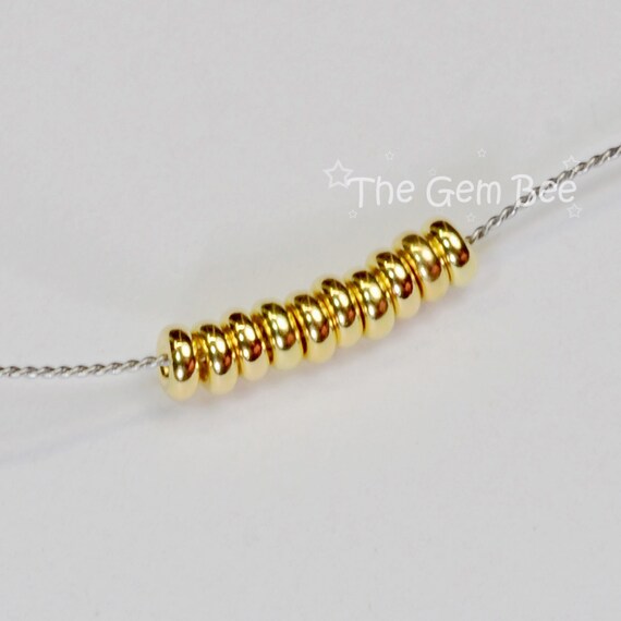 thumbnail image 2 of 4.2mm 14k Solid Yellow Gold Smooth Donut Rondelle Bead Spacer - 10 Pieces 2 of 5