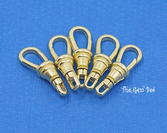 May include: Five gold-toned metal lobster claw clasps arranged in a fan shape. Each clasp features a smooth, polished finish with a spring-loaded mechanism and a swivel base. The text The Gem Bee is printed in white in the lower right corner.