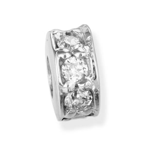 May include: A silver charm bracelet bead with a decorative design and clear cubic zirconia stones.