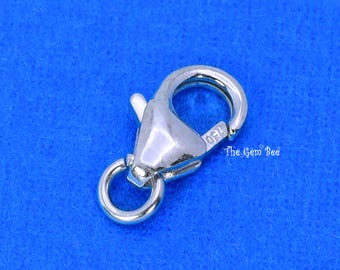 May include: A silver-toned lobster claw clasp featuring a spring-loaded mechanism and a small circular attachment ring. The metal surface is polished and reflective, with the number 150 stamped on the side and the text The Gem Bee nearby.