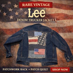 May include: A vintage Lee denim trucker jacket with a patchwork back featuring American flag designs. The jacket is a medium wash blue with various fabric patches. The words "Rare Vintage" and "Lee" are displayed at the top.