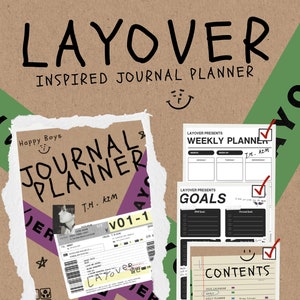 May include: A brown cardboard box with a torn edge revealing a journal planner with the text "LAYOVER" and "JOURNAL PLANNER" in black. The planner has a green, purple, and white design with a smiling face and the text "Happy Boys" and "T.H. KIM".