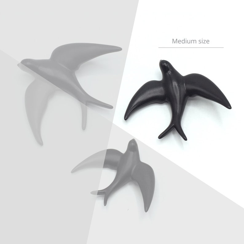 May include: Three black ceramic swallow bird wall decor pieces in different sizes. The largest swallow is labeled "Medium size".