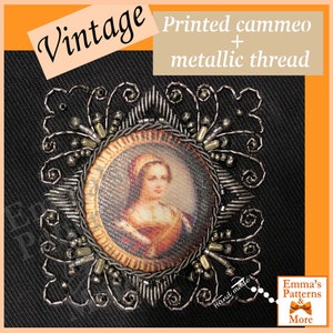 May include: A vintage cameo portrait of a woman in a gold frame, surrounded by a hand-stitched design of silver beads and metallic thread. The design includes swirls and loops, creating a decorative border around the cameo.