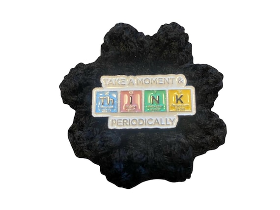 A fully crocheted periodic table fridge magnet — genuinely handmade textile craft meets science nerd obsession in a way you won't find at Target.