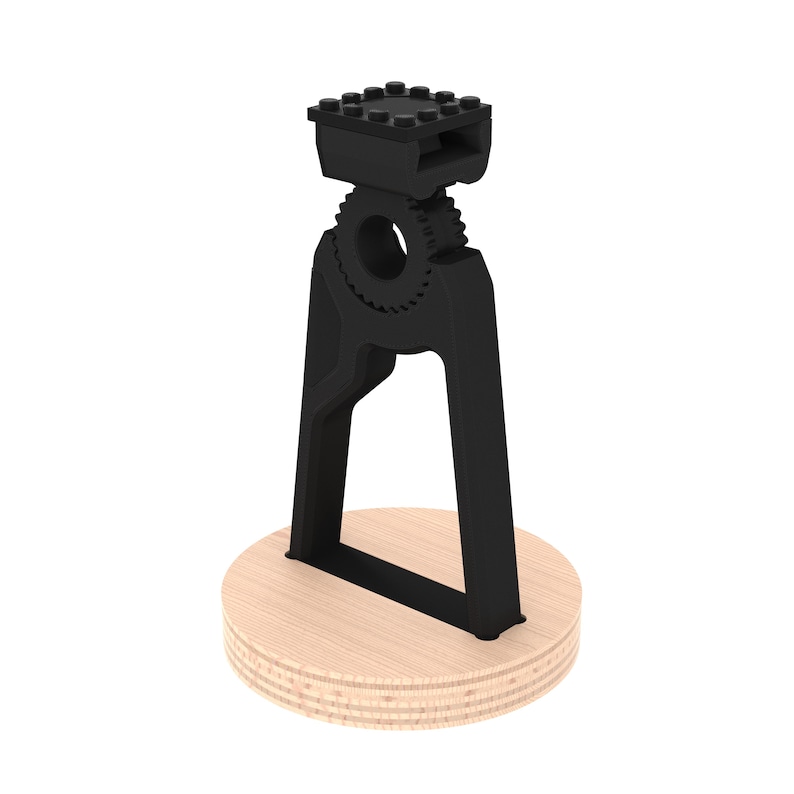 May include: Black 3D printed phone stand with a gear design and a wooden base.