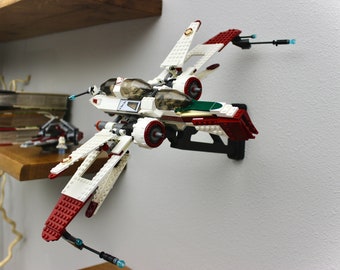 May include: A white and red Lego Star Wars V-4X-D starfighter with green accents. The starfighter is mounted on a black wall mount.