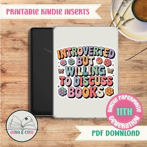 May include: A Kindle Paperwhite case featuring the text "Introverted But Willing To Discuss Books" in a retro style. The case is white with colorful floral and butterfly designs. The image also includes the text "Printable Kindle Inserts" and "PDF Download".