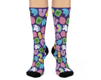 May include: A pair of purple socks with a colorful pattern of marshmallows, rainbows, and stars. The socks are made of a soft, comfortable material and are perfect for everyday wear.