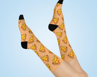 May include: A pair of tan socks with a pizza slice pattern. The socks have black toes and heels.