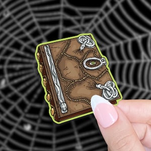 manual of witchcraft and alchemy sticker
