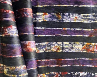 May include: Striped fabric with a batik design in shades of purple, black, and white. The fabric has a textured, crinkled look.