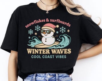 Snowman Surfing Christmas Tee – Winter Waves Coastal Shirt