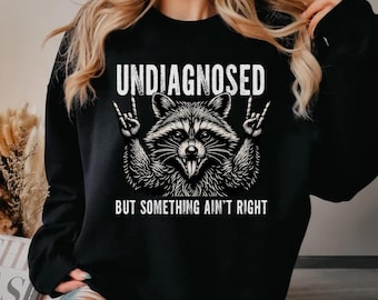 Undiagnosed But Something Ain't Right Sweatshirt Women, Funny Raccoon Crewneck, Mental Health Humor Top, Sarcastic Gift Her, Black Sweater