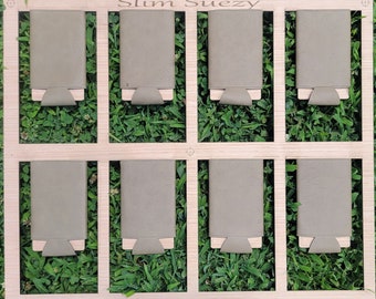 May include: A wooden display board with the text "Slim Suezy" at the top. Eight gray leather wallets are displayed on the board.