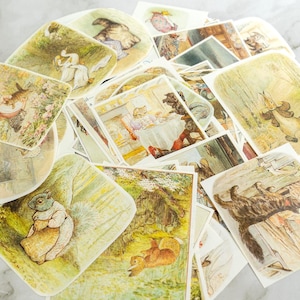Peut inclure: Une collection d'éphémères en papier de style vintage avec des illustrations d'animaux dans un cadre de livre d'histoires. Les images sont dans des couleurs pastel douces, avec des scènes d'écureuils, de lapins et d'autres créatures.