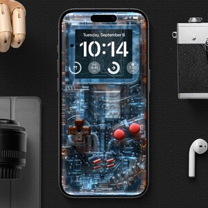 May include: A clear phone case with a retro game console design. The case has a blue and green circuit board pattern with red buttons and a digital clock display that reads "10:14". The clock also shows the date "Tuesday, September 6".