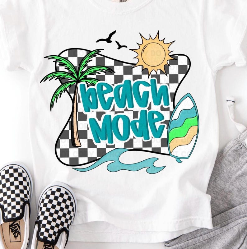 May include: White t-shirt with a graphic design of a palm tree, sun, surfboard, and checkered pattern. The text "Beach Mode" is written in blue and black letters.