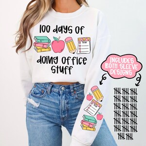 May include: White sweatshirt with the text "100 days of doing office stuff" and illustrations of books, an apple, a pencil, and a to-do list. The sleeve design includes the same illustrations and tally marks.
