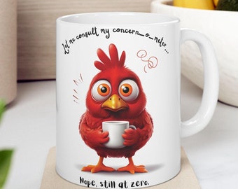 May include: White ceramic mug featuring a cartoon red bird holding a small white cup. The mug has the text "Let me consult my concern-o-meter... Nope, still at zero."