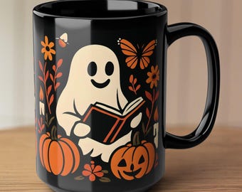 Taza de café con fantasma de Halloween leyendo, linda decoración de calabaza otoñal