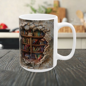 May include: White ceramic mug with a colorful image of a bookshelf bursting through a cracked wall. The bookshelf is filled with various books.