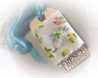 Sampler Vintage Floral Fabric wrapped around a French inspired gift tag