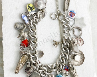 A Fantastic Vintage Sterling Silver Charm Bracelet Loaded with Charms from Around the World, Circa 1950's