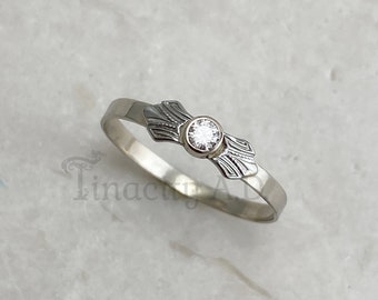 A Handmade 14k White Gold Band with Vintage Art Deco FIligree Accents and Bezel Set Round Brilliant Cut Diamond
