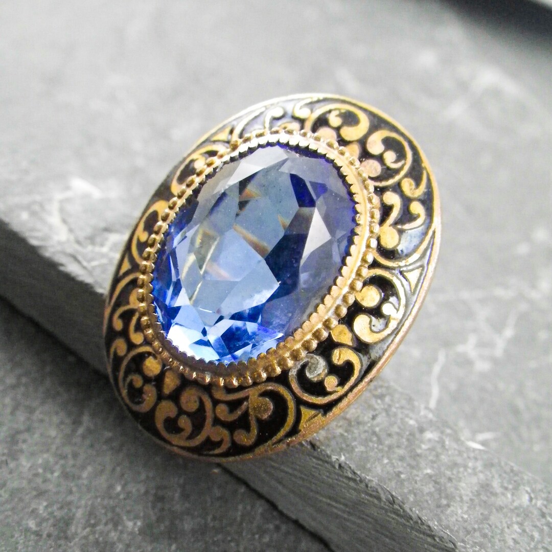 A Vintage Art Nouveau Statement Ring Featuring a Large Faceted Blue ...