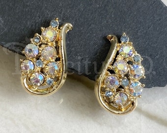 A Pair of Vintage Clip Earrings Featuring Teal-Golden Aurora Borealis Rhinestones and Gold-Tone Settings, Made by Star, Circa 1960's
