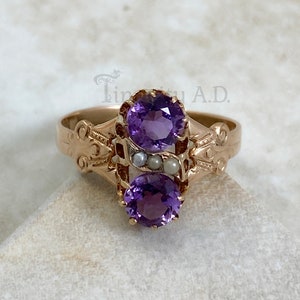 A 10-Karat Rose Gold Late Victorian Ring Featuring Prong Set Amethysts with Seed Pearl Accents, Circa 1900