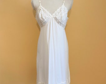 A Vintage Vanity Fair Dress Slip, Knee Length with Lacy Trim, Size 36, Circa 1960's