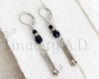 A Pair of Dangle Earrings Made of a Repurposed Art Deco Filigree Bar Pin with Black Beads and Rhinestones