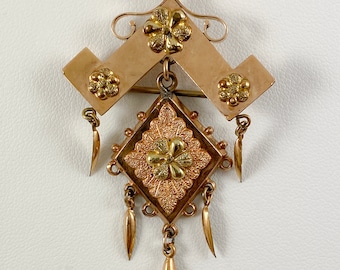 An Antique Victorian Pin-Pendant and Chain Featuring Applied Floral Details and Whimsical Dangling Elements, Gold-Filled, Circa 1880's