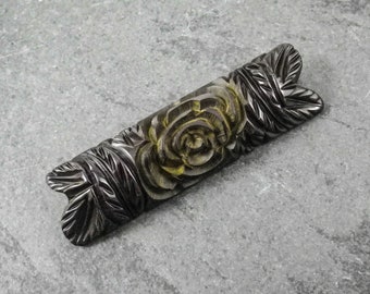 A Vintage Art Deco Black Carved Bakelite Bar Brooch with Elaborate Flower Design, Circa 1940's