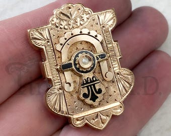 An Antique Victorian Shield-Shaped Brooch, Gold-Filled with Hidden Locket Compartment, Accented with Enameling and Pearl, Circa 1880's.