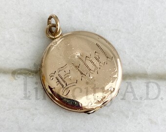 Ein Vintage Edwardian Gold-gefülltes Medaillon, runde Form mit Ethel graviert zusammen mit Baby Teeth-Markierungen, circa 1915