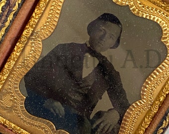 An Antique Union Case with Image of Seated Young Man, Embossed Paper Exterior and Velvet Interior, Circa 1860's