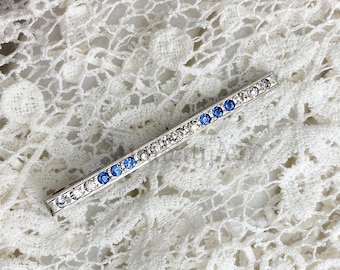 A Vintage Art Deco Sterling Silver Bar Pin Featuring Vivid Sapphire Blue and Clear Rhinestones, Dating to 1923