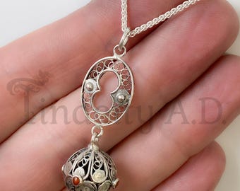 A Vintage Elements Dangle Pendant Featuring Vintage Silver Filigree and Orangy-Red Coral Cabochons, Circa 1960's with a New Sterling Chain.