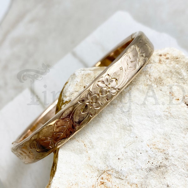 A Vintage Edwardian Yellow Gold-Filled Hinged Bangle Bracelet with Exotic Flower Stamped Design, Circa 1910