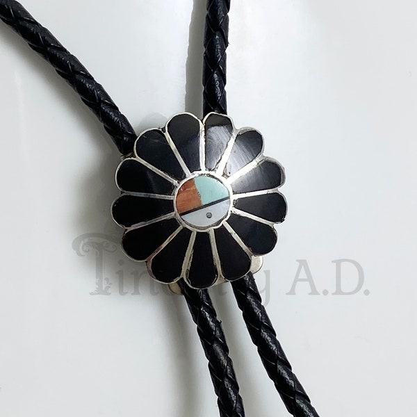 A Vintage Sterling Silver Zuni Bolo Tie with Inlaid Stones and Braided Black Leather Cord with Sterling Tips, Circa 1970's